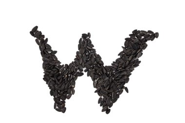 Latin alfabesinin harfleri ayçiçeği tohumlarıyla dizilmiştir. W harfi.