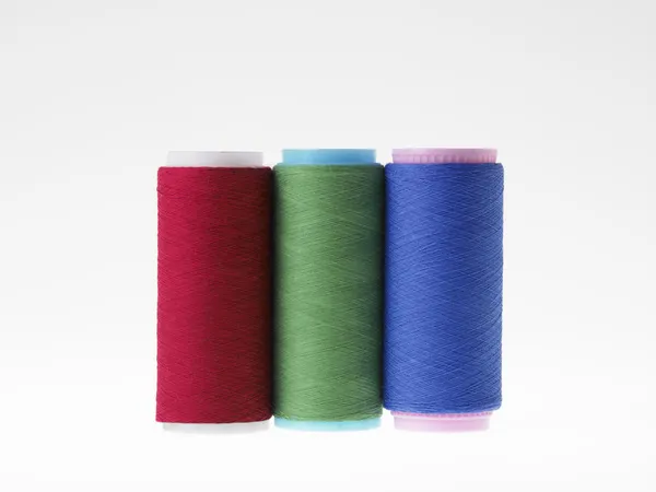 Colors, spools of thread on a white background — Stock Photo, Image