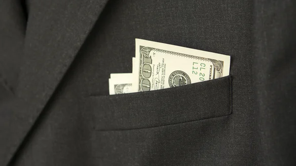 Dollar bills in the pocket of a jacket — Stock Photo, Image
