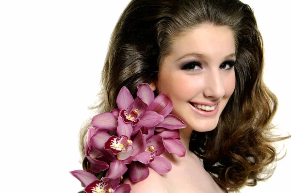 Beauty with orchids — Stock Photo, Image