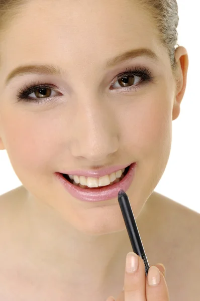 Woman applying cosmetics — Stock Photo, Image