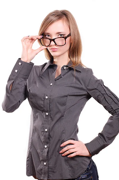 Ung flicka med glasögon på en vit bakgrund — Stockfoto