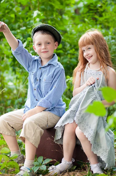 Little boy and girl in the park Royalty Free Stock Photos