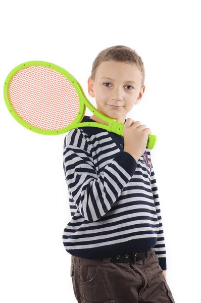 Niño con raqueta de tenis sobre fondo blanco — Foto de Stock