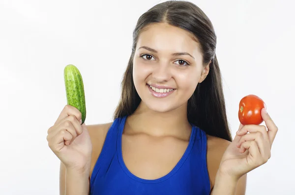 Flicka med grönsaker på vit bakgrund — Stockfoto