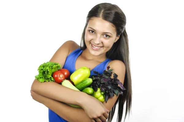 Flicka med grönsaker på vit bakgrund — Stockfoto