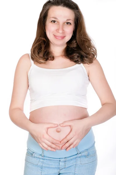Mladá těhotná žena na bílém pozadí — Stock fotografie