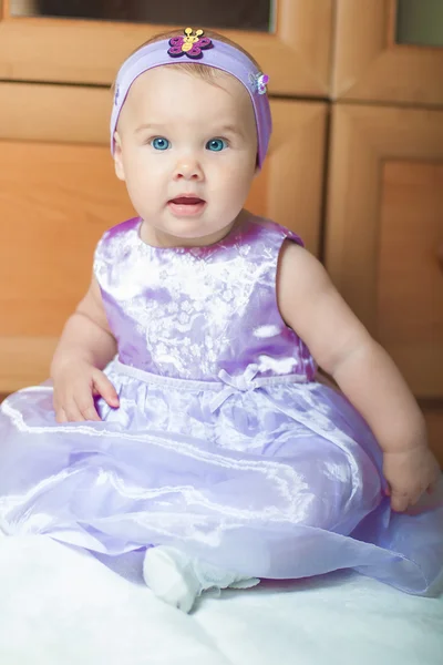 Little girl in a beautiful dress at home — Stock Photo, Image
