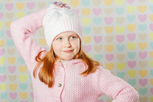 Little girl in a pink hat and a sweater — Stock Photo, Image