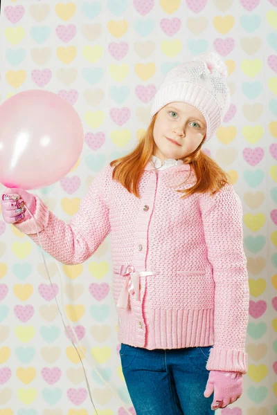 Little girl in a pink hat and a sweater — Stock Photo, Image