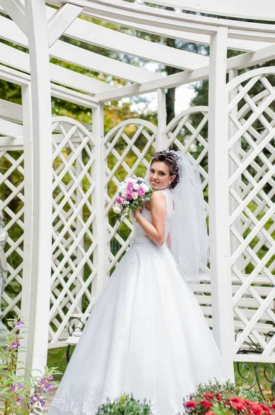 Young beautiful bride with bouquet — Stock Photo, Image