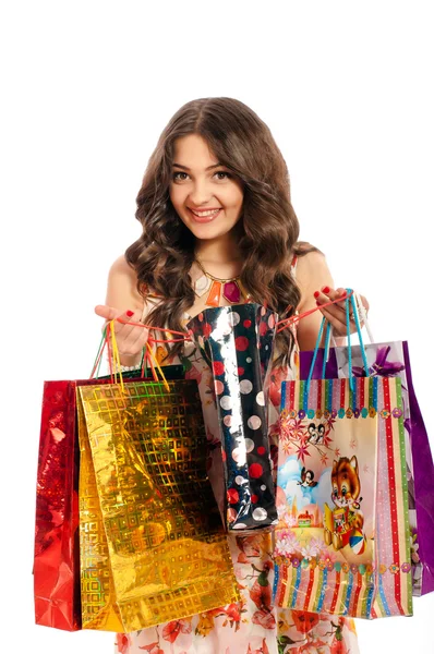 Young beautiful girl with shopping bags on white background — Stock Photo, Image