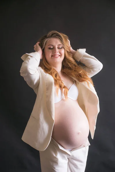 Young Cute Pregnant Woman Long Red Hair White Trouser Suit — стокове фото