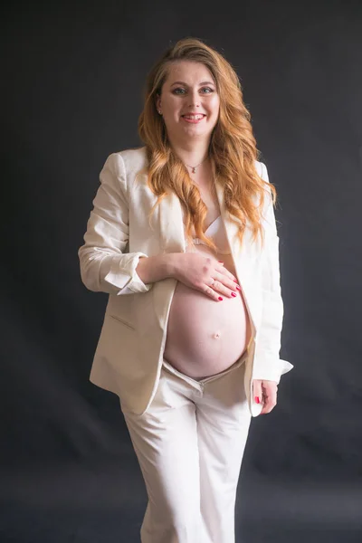 Young Cute Pregnant Woman Long Red Hair White Trouser Suit — стокове фото