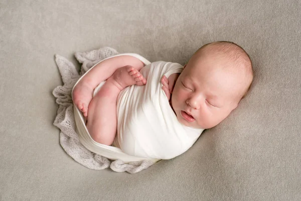 Cute Baby Sleeps Wrapped Airy Milk Colored Blanket Beige Plaid — Stock Photo, Image