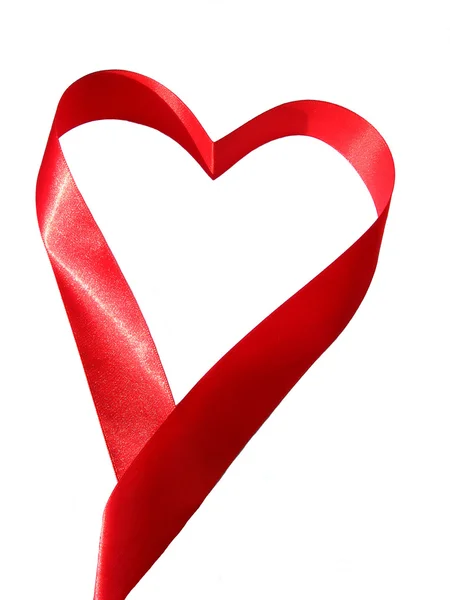 红色丝质丝带的心脏 图库图片