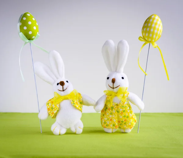 Easter funny bunnies with eggs