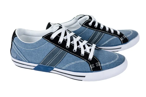 Chaussures en gomme bleues modernes isolées sur blanc Photo De Stock