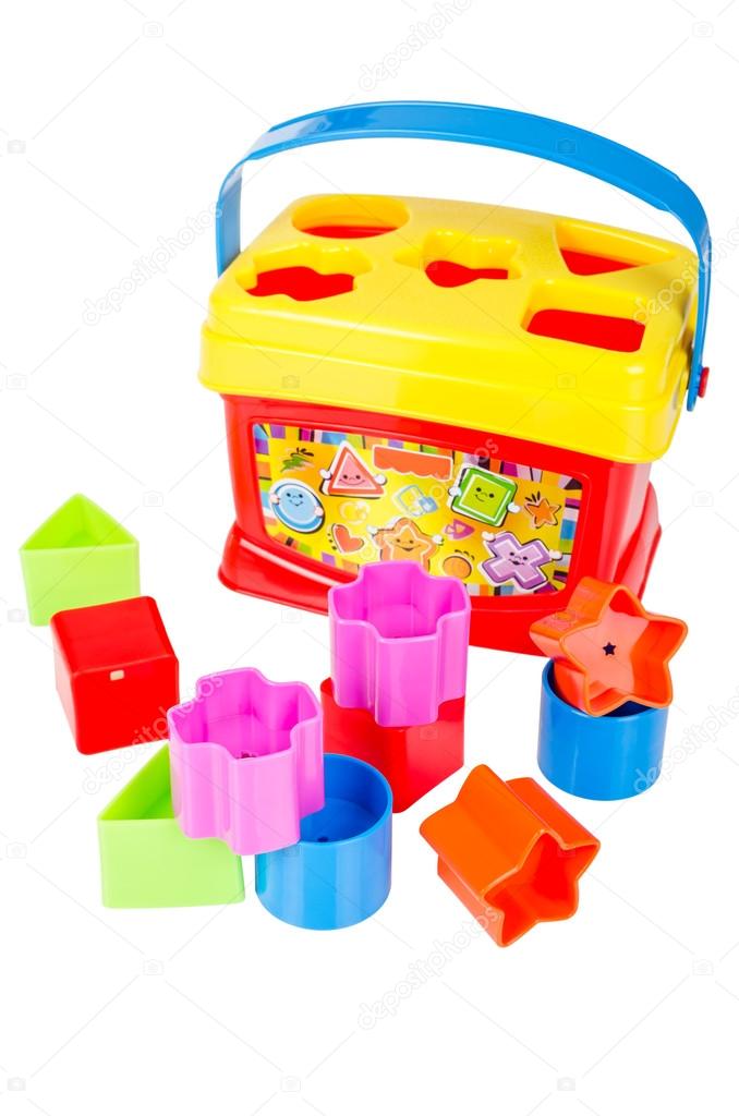 Shape sorter toy with various coloured blocks isolated