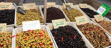 Fresh olives on the open air market clipart