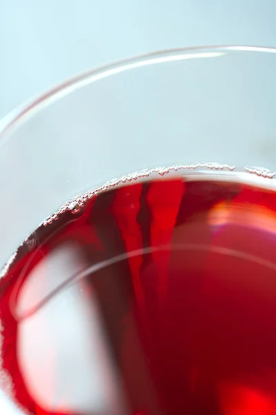 Glass of freshly poured red wine — Stock Photo, Image