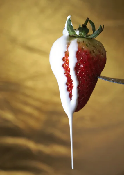 Strawberries and cream on a fork — Stock Photo, Image