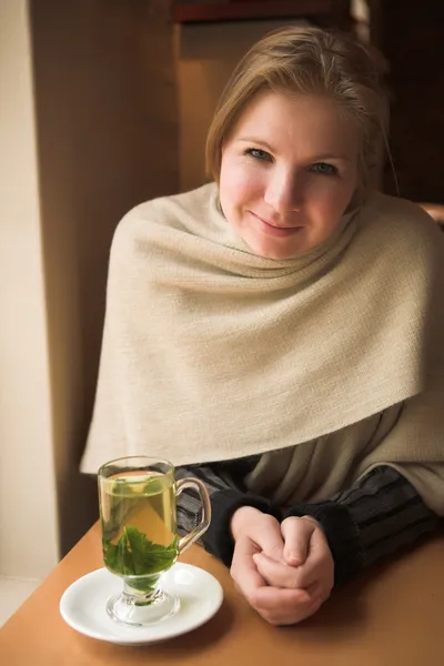 Blonde caucasian adult woman with hot mint tea — Stock Photo, Image