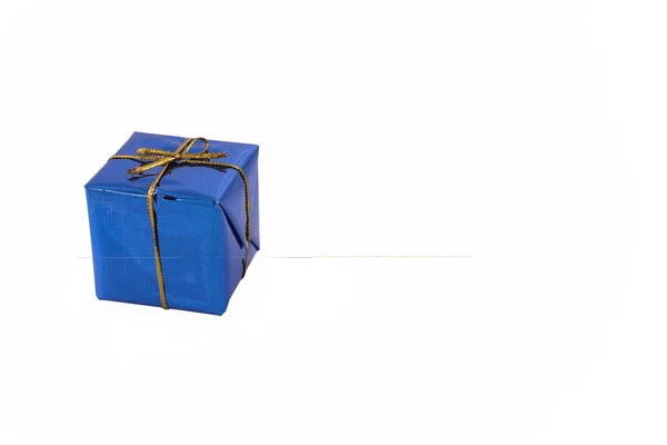 Gift with golden ribbon — Stock Photo, Image