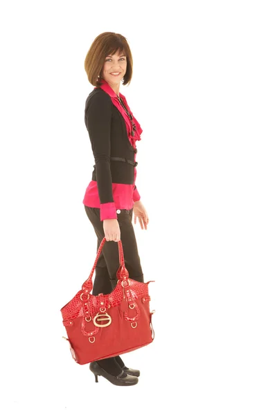 Sexy junge erwachsene kaukasische Geschäftsfrau mit einer roten Ledertasche — Stockfoto