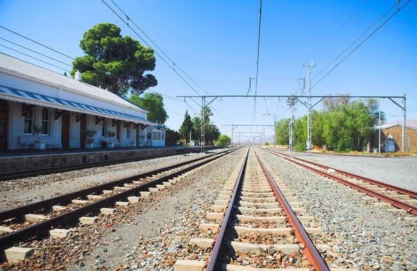 Train tracks in front of the train station — Stock Photo, Image