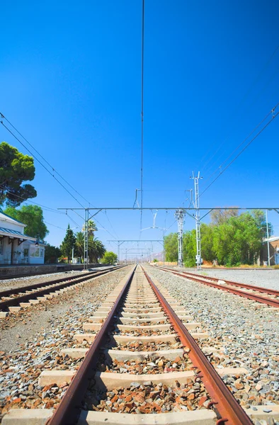 Train tracks in front of the train station — Stock Photo, Image