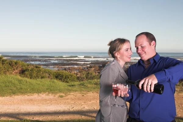 Loving young adult couple drinking wine — Stock Photo, Image
