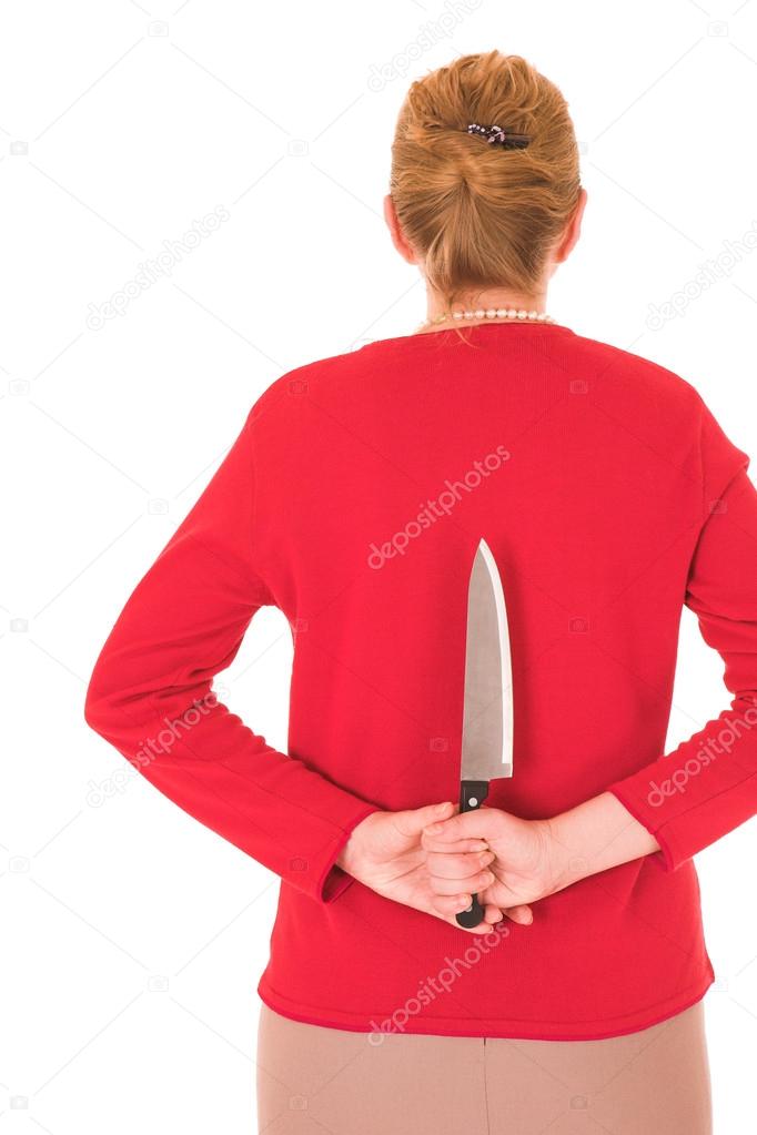 Blonde middle aged woman with a large carving knife