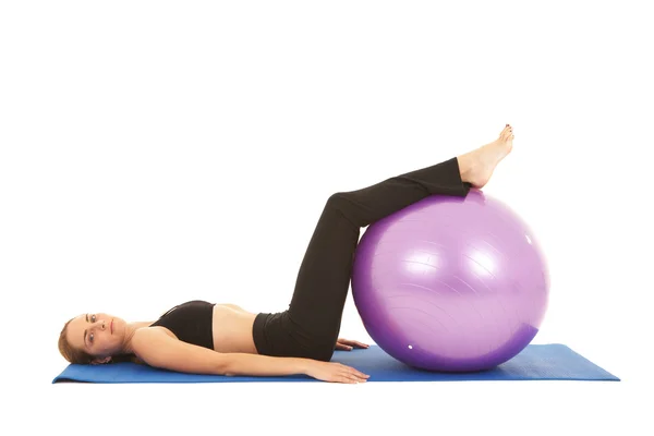 Fit young brunette pilates instructor showing different exercises — Stock Photo, Image