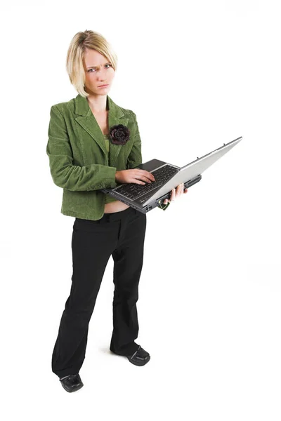 Business woman green jacket, working on laptop — Stock Photo, Image