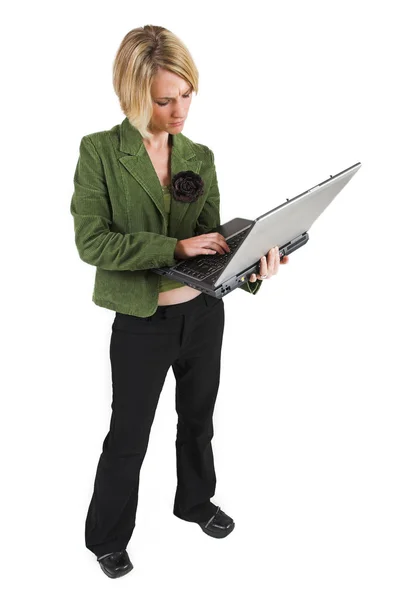 Business woman green jacket, working on laptop — Stock Photo, Image