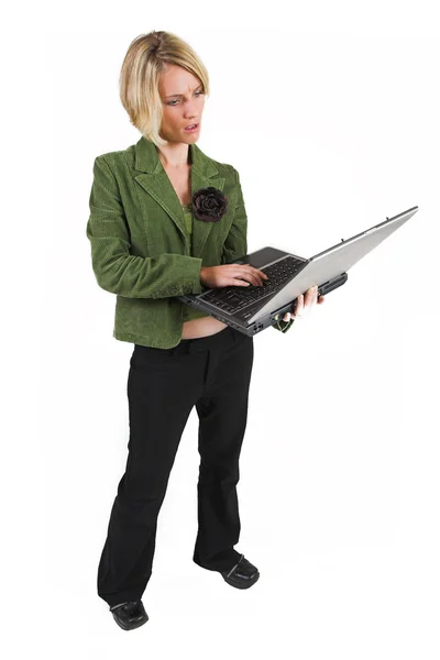 Business woman green jacket, working on laptop — Stock Photo, Image