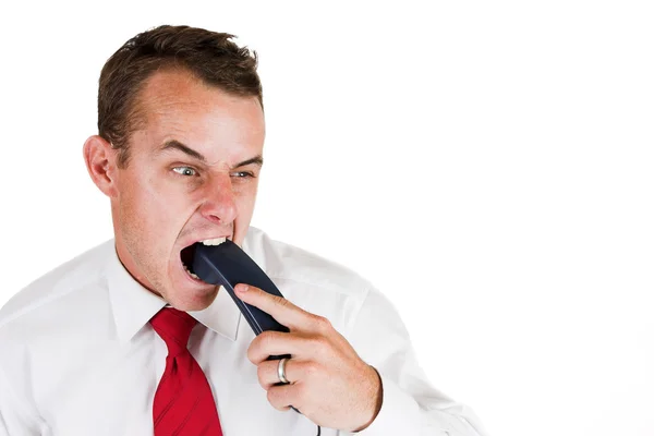 Empresario mordiendo el teléfono — Foto de Stock