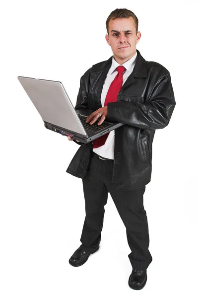 Zakenman in een pak met een notebook-computer — Stockfoto