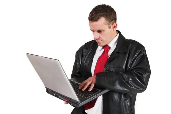 Hombre de negocios de pie con computadora portátil —  Fotos de Stock