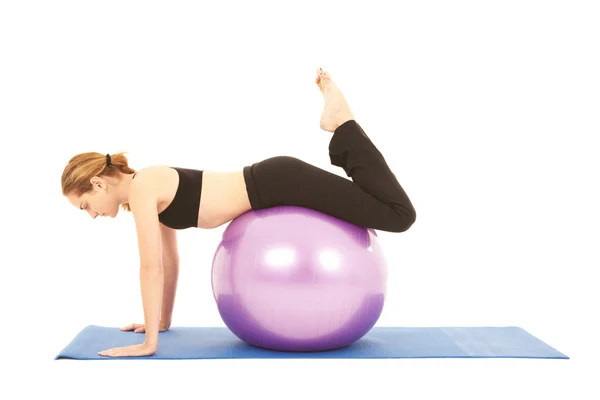 Fit young brunette pilates instructor showing different exercises — Stock Photo, Image