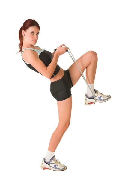 Woman looking serious in gym wear holding skipping rope. — Stock Photo, Image