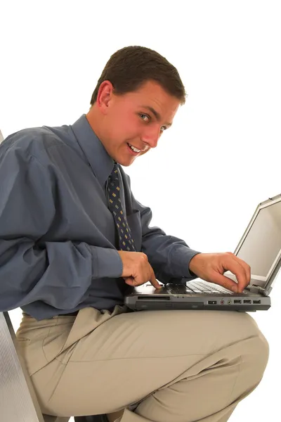 Man sitting on ladder working on laptop — Stock Photo, Image