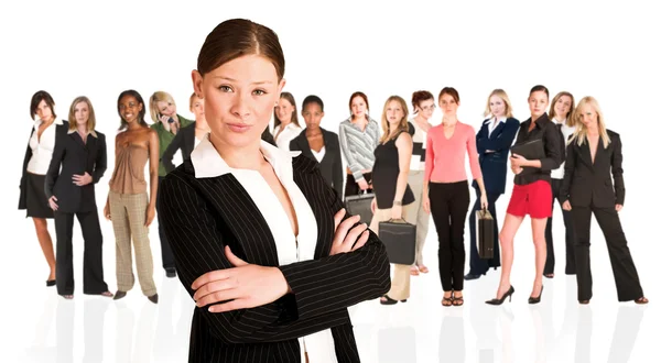 Beautiful businesswoman standing in front of a group of business Stock Photo