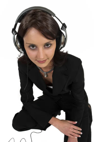 Forretning kvinde med hovedtelefoner - Stock-foto