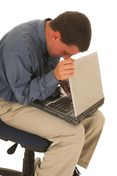 Man working on a laptop on his lap. — Stock Photo, Image