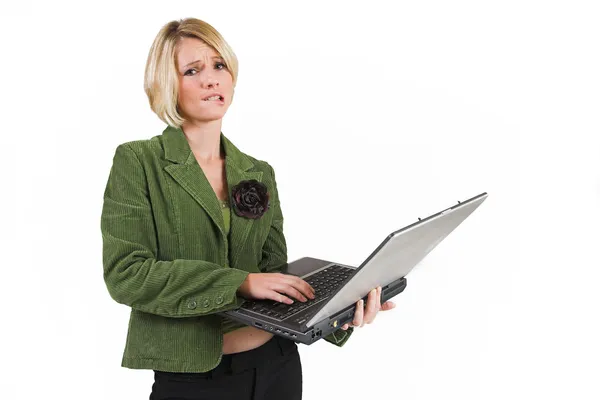 Business woman green jacket, working on laptop — Stock Photo, Image