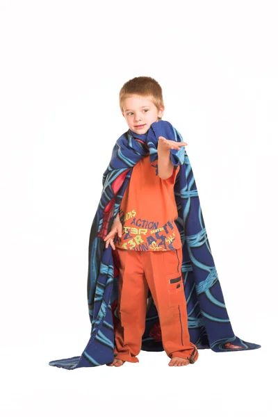 A boy wearing a blanket as a cape, holding out his hand — Stock Photo, Image
