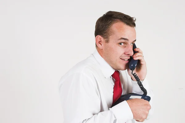 Business man in a suit with a telephone — Stock Photo, Image