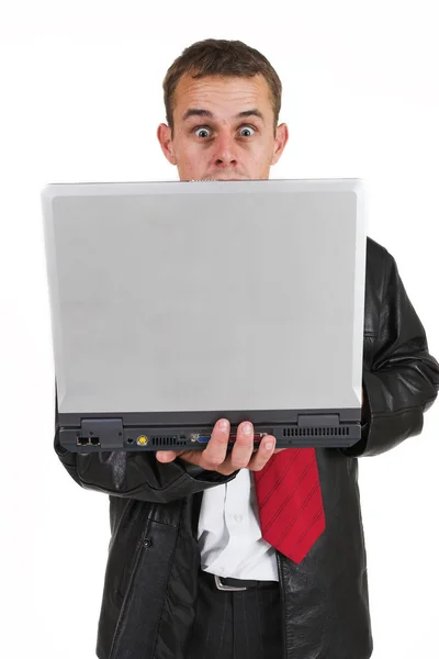 Homem de negócios em um terno com um computador portátil — Fotografia de Stock